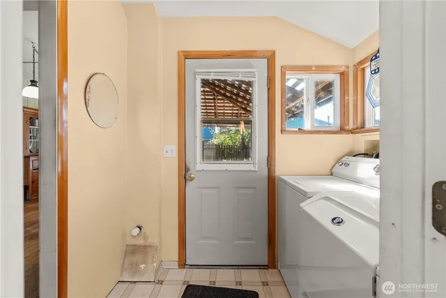 a bathroom with a granite countertop sink toilet and mirror