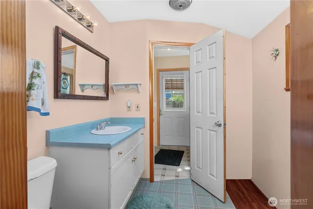 a bathroom with a glass shower door