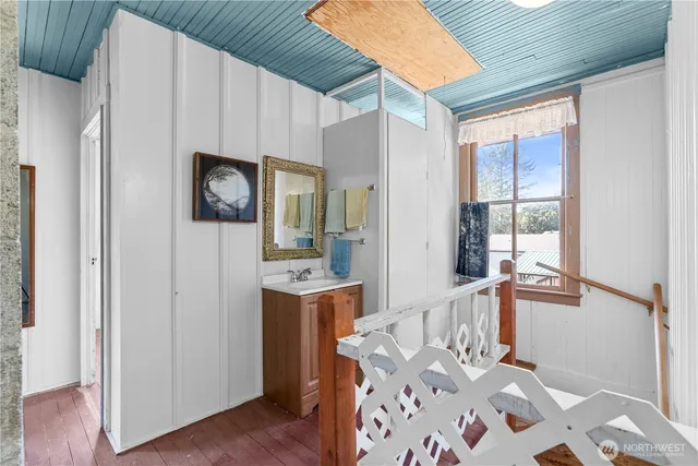 a white toilet sitting next to a shower