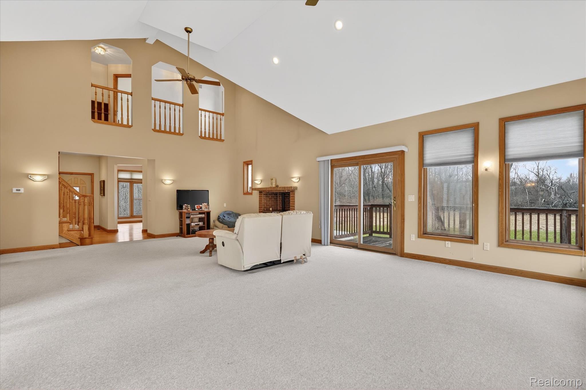 5640 Fisher Road Howell, MI 48855 - Photo 18 of 66 Living room featuring light carpet, a ceiling fan, recessed lighting, and vaulted ceiling