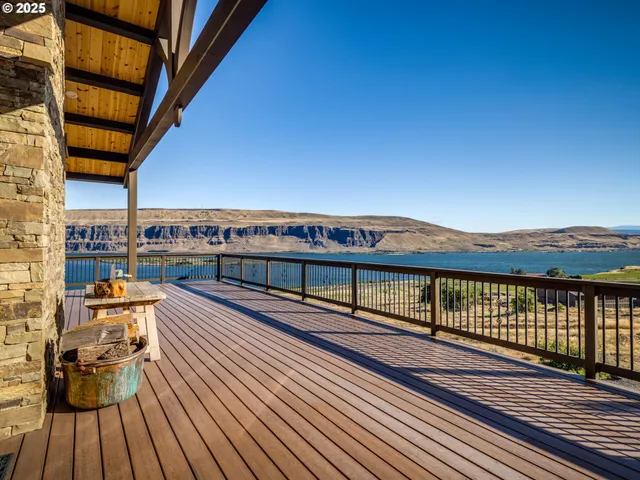 a view of balcony with wooden floor and city view