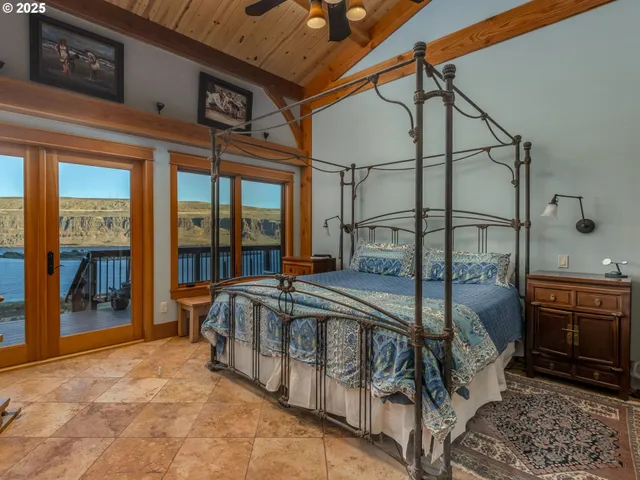 a view of a bedroom with wooden floor