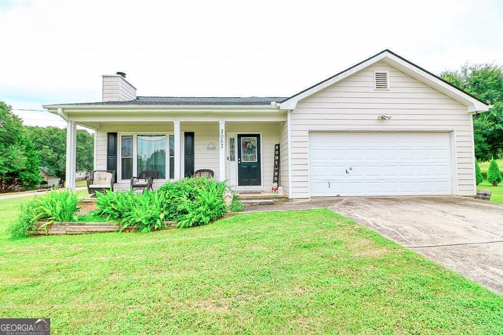 2053 Providence Road Statham, GA 30666 - Photo 1 of 1 a front view of a house with garden