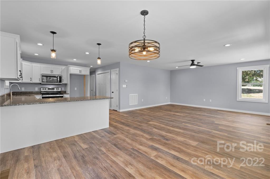 8 Split Rail Drive Asheville, NC 28806 - Photo 15 of 24 a view of kitchen and kitchen with stainless steel appliances granite countertop living room