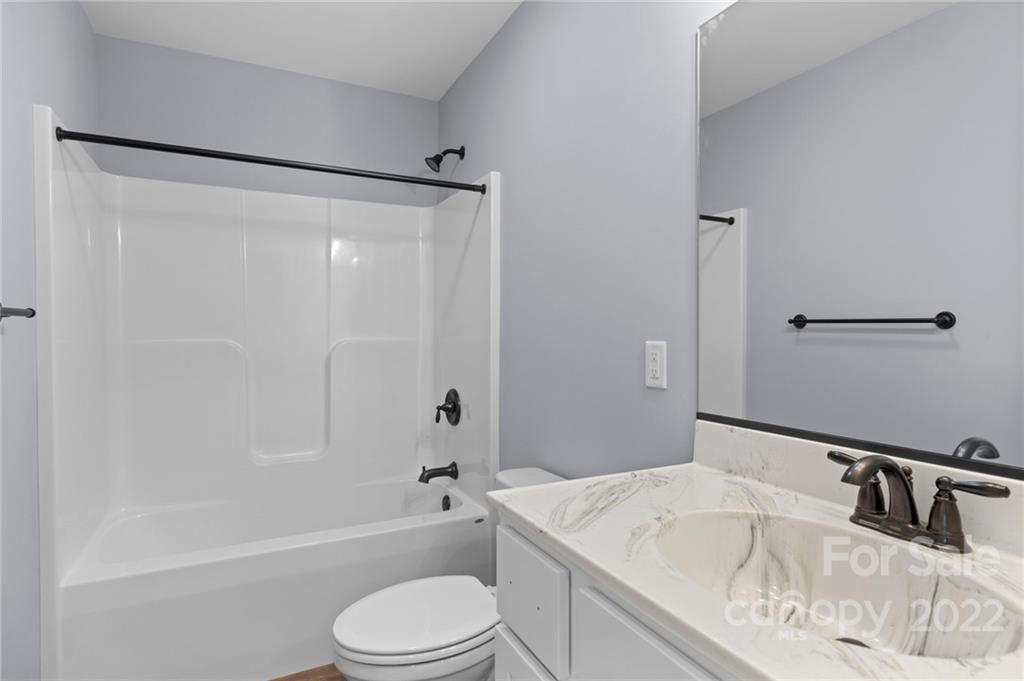 8 Split Rail Drive Asheville, NC 28806 - Photo 18 of 24 a bathroom with a granite countertop sink toilet and shower