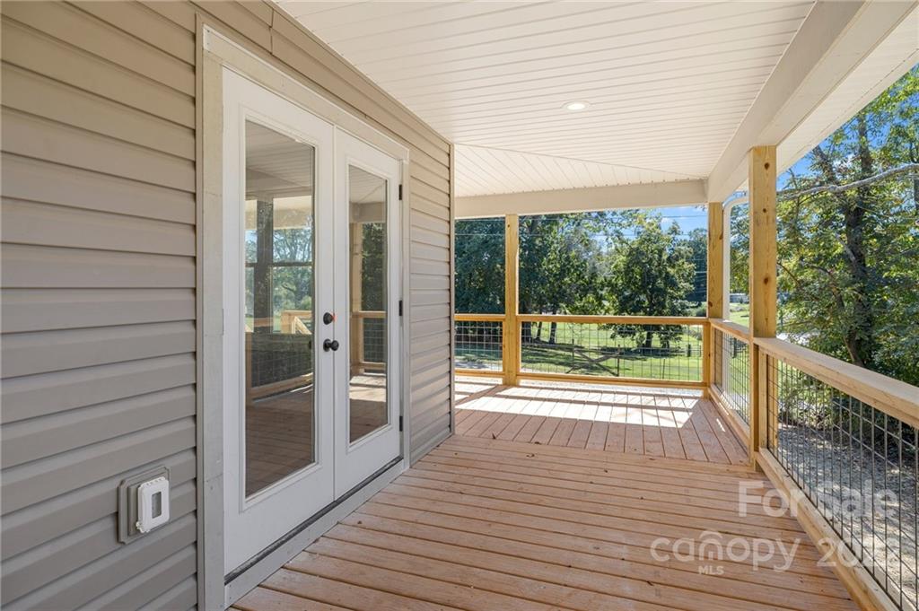 8 Split Rail Drive Asheville, NC 28806 - Photo 4 of 24 a view of a balcony with wooden floor