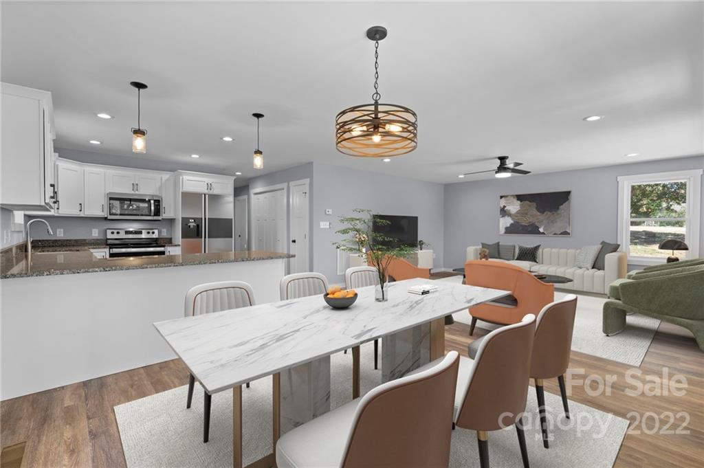 8 Split Rail Drive Asheville, NC 28806 - Photo 5 of 24 a view of a dining room and a kitchen with a table chairs
