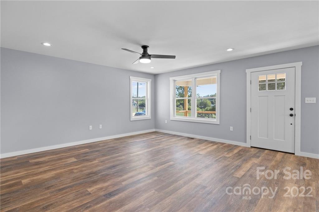 8 Split Rail Drive Asheville, NC 28806 - Photo 8 of 24 a view of an empty room with wooden floor and a window