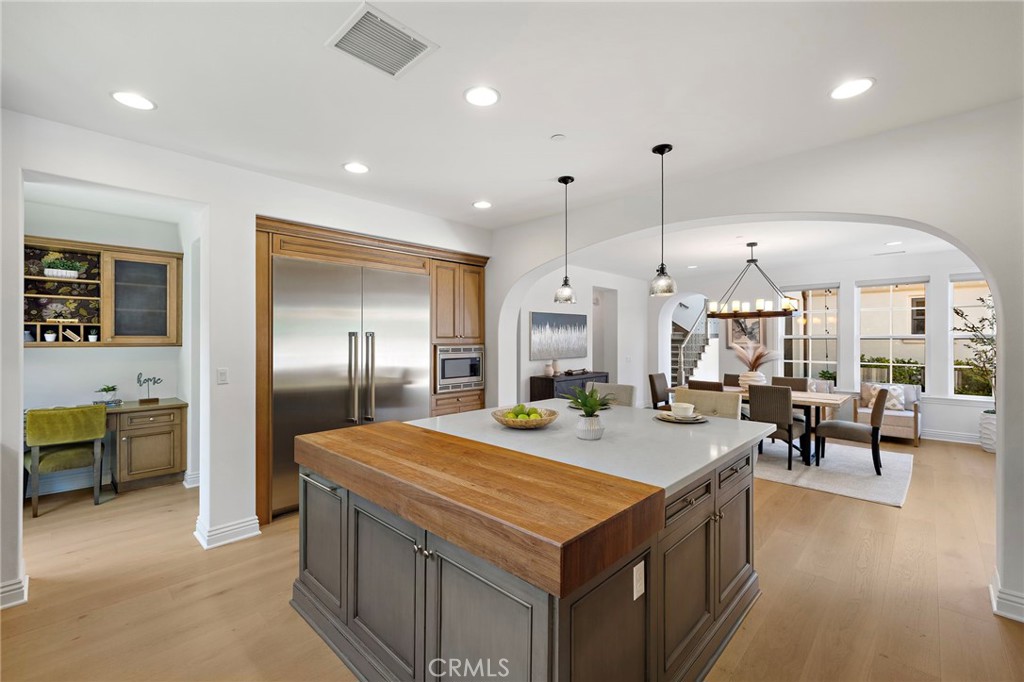4 Gaucho Road Ladera Ranch, CA 92694 - Photo 11 of 40 a kitchen with stainless steel appliances granite countertop a sink and a refrigerator