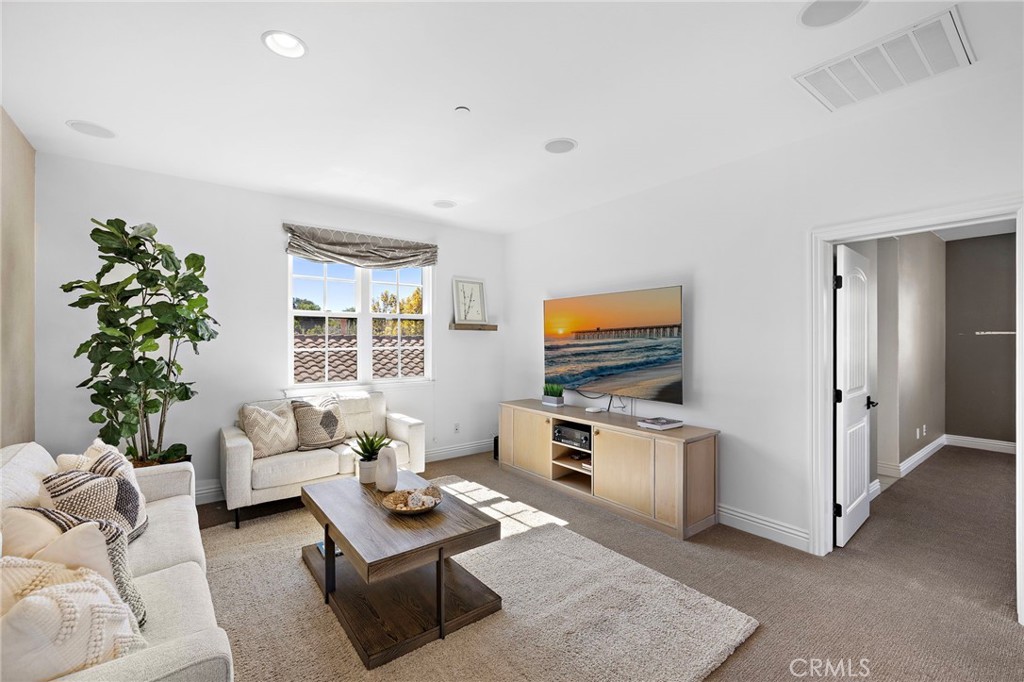 4 Gaucho Road Ladera Ranch, CA 92694 - Photo 22 of 40 a living room with furniture kitchen view and a window