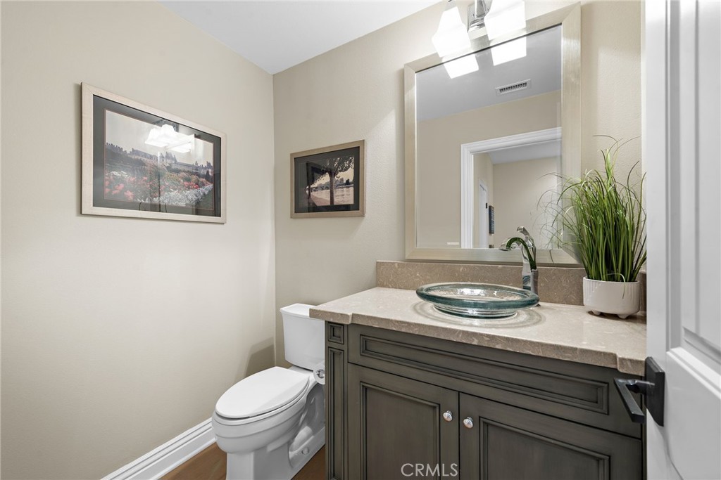 4 Gaucho Road Ladera Ranch, CA 92694 - Photo 25 of 40 a bathroom with a sink toilet and a mirror