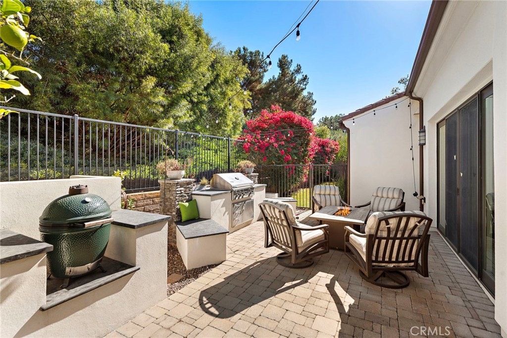 4 Gaucho Road Ladera Ranch, CA 92694 - Photo 28 of 40 a view of a chairs and tables back yard of the house