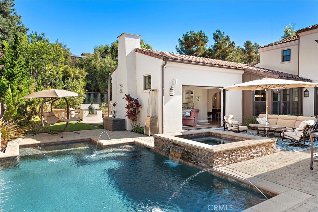 4 Gaucho Road Ladera Ranch, CA 92694 - Photo 5 of 40 a view of a house with swimming pool and sitting area