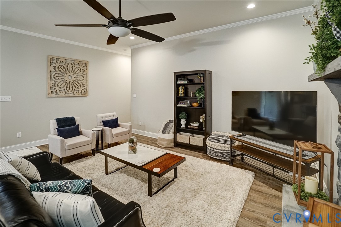 4669 Woburn Road Providence Forge, VA 23140 - Photo 20 of 78 a living room with furniture and a flat screen tv