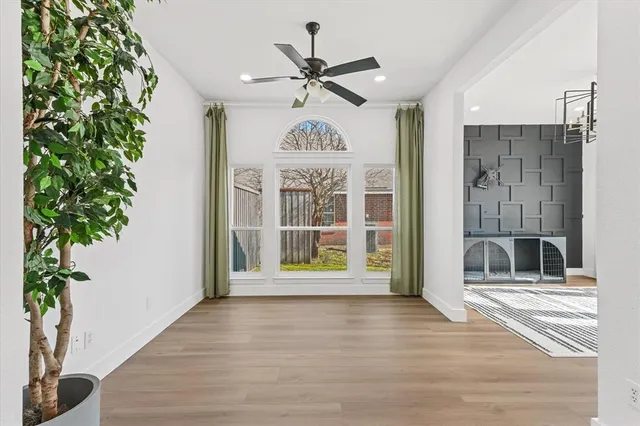 a view of an entryway with wooden floor and a chandelier