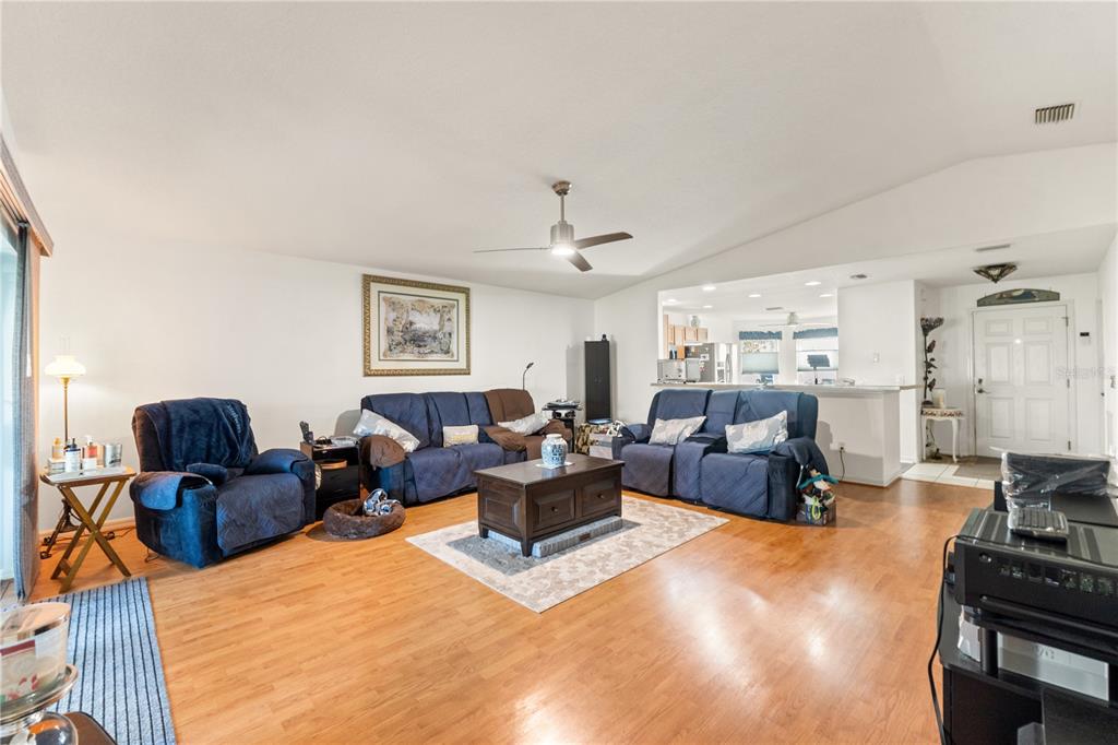 15819 Southwest 13th Circle Ocala, FL 34473 - Photo 12 of 34 a living room with furniture and a large window