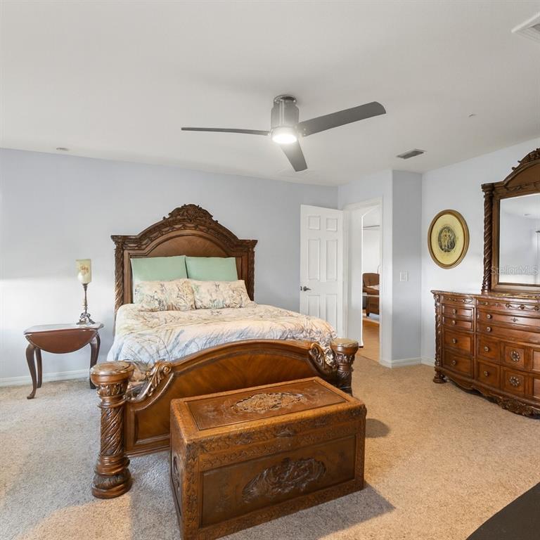 15819 Southwest 13th Circle Ocala, FL 34473 - Photo 15 of 34 a bedroom with a bed and window