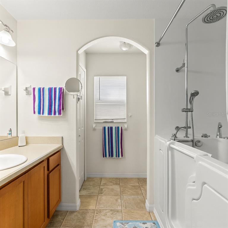 15819 Southwest 13th Circle Ocala, FL 34473 - Photo 16 of 34 a bathroom with a sink and a mirror