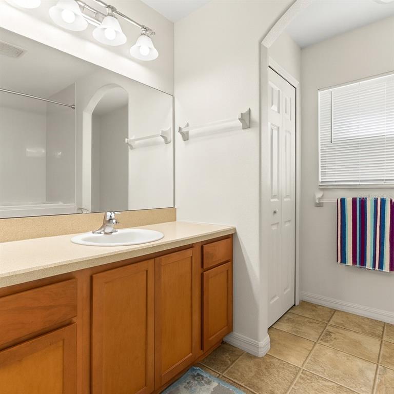 15819 Southwest 13th Circle Ocala, FL 34473 - Photo 17 of 34 a bathroom with a sink and a mirror