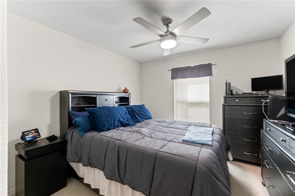 15819 Southwest 13th Circle Ocala, FL 34473 - Photo 19 of 34 a bedroom with a bed and dresser