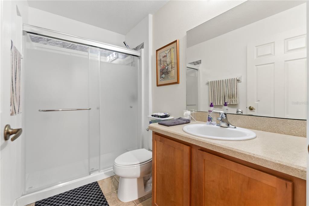 15819 Southwest 13th Circle Ocala, FL 34473 - Photo 21 of 34 a bathroom with a sink toilet and shower