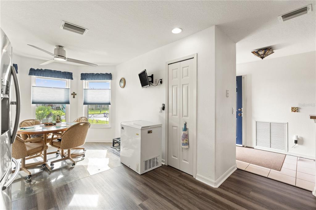 15819 Southwest 13th Circle Ocala, FL 34473 - Photo 9 of 34 a living room with furniture and wooden floor