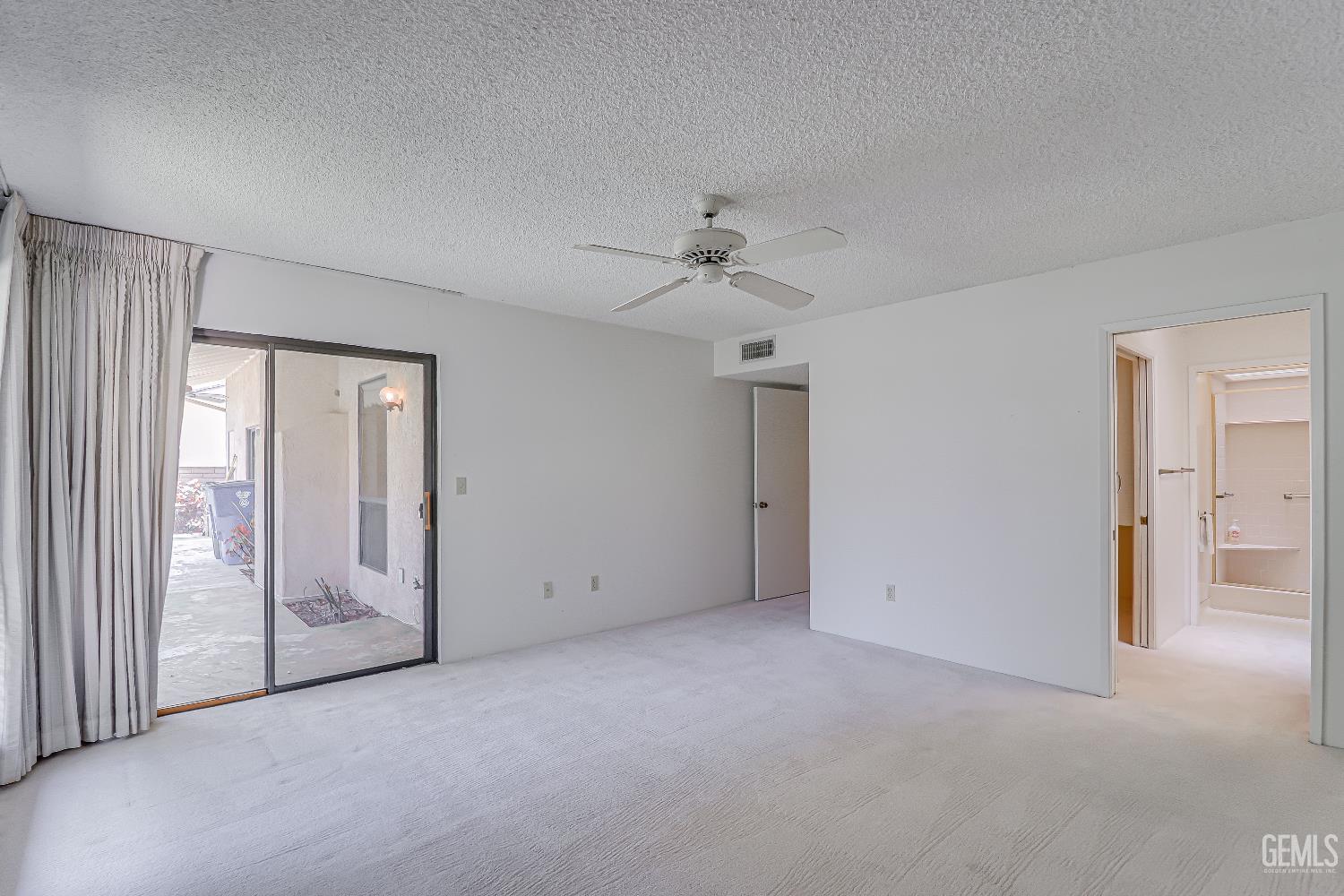 Undisclosed Address Bakersfield, CA 93309 - Photo 18 of 37 an empty room with fan and entrance