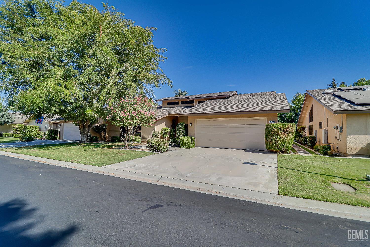 Undisclosed Address Bakersfield, CA 93309 - Photo 2 of 37 a view of backyard of house with outdoor seating and green space