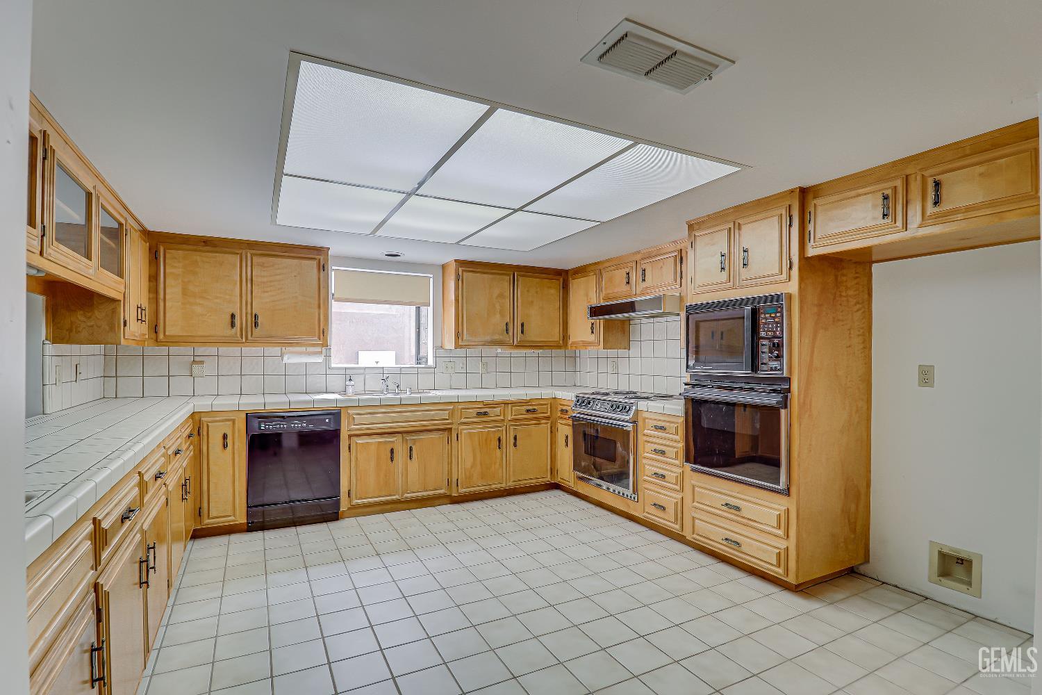 Undisclosed Address Bakersfield, CA 93309 - Photo 31 of 37 a kitchen with stainless steel appliances granite countertop a stove and a sink
