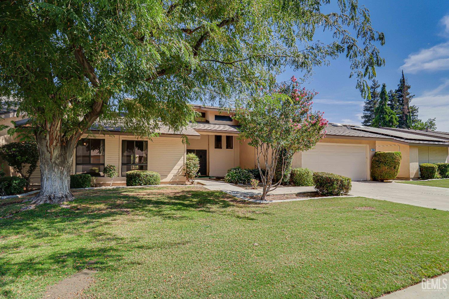 Undisclosed Address Bakersfield, CA 93309 - Photo 4 of 37 a house with trees in the background