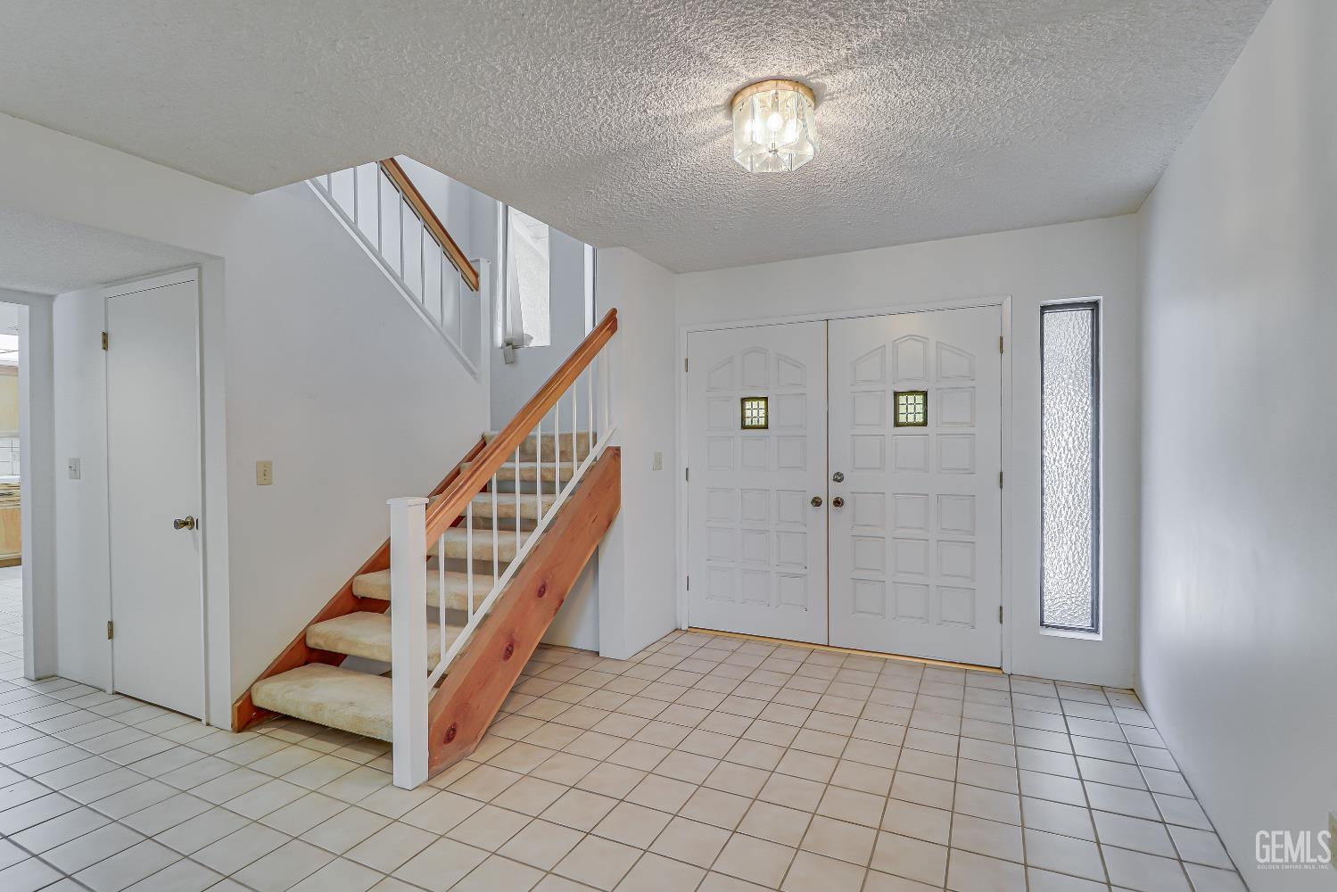 Undisclosed Address Bakersfield, CA 93309 - Photo 7 of 37 a view of a hallway with windows and stairs