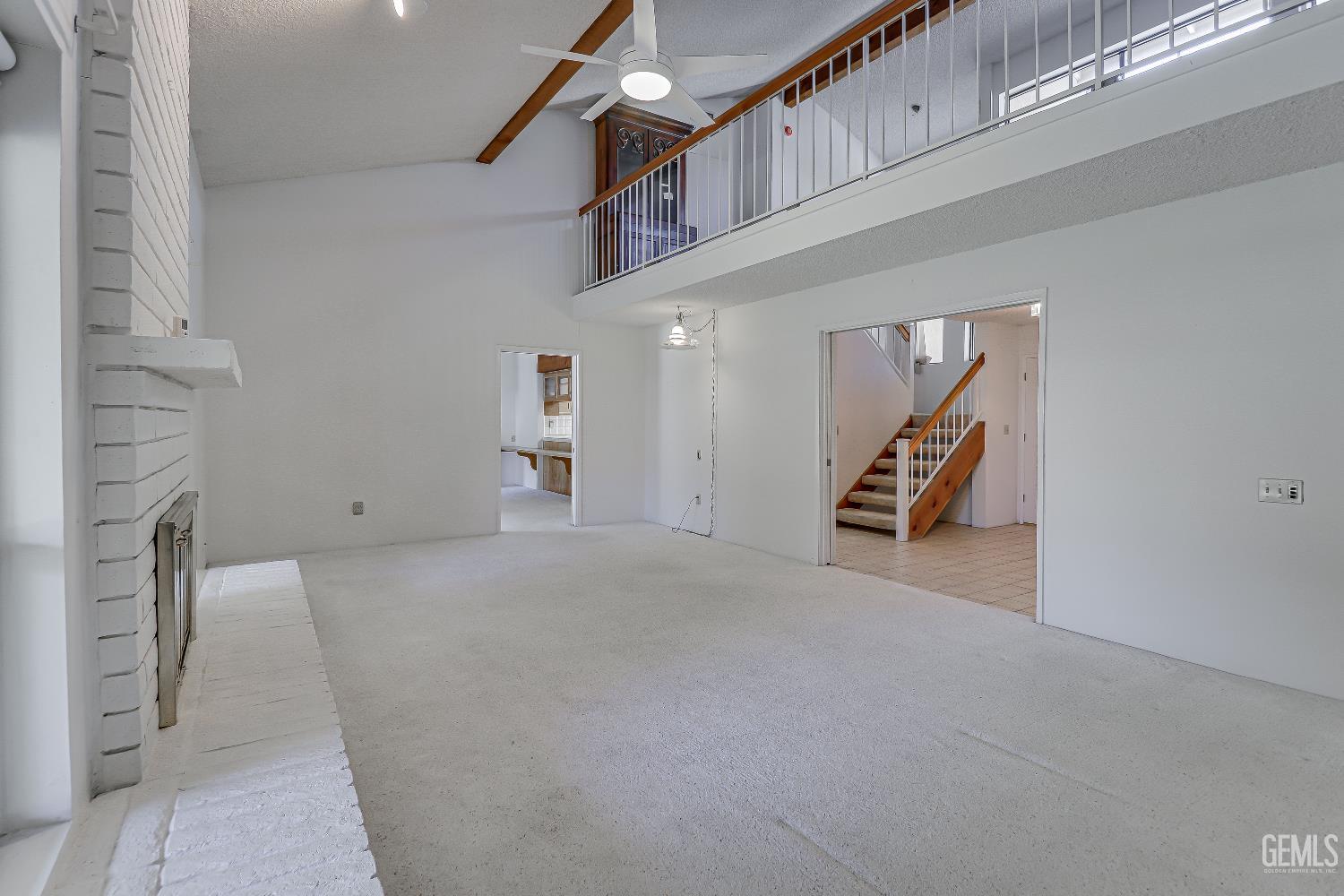 Undisclosed Address Bakersfield, CA 93309 - Photo 9 of 37 a view of a livingroom with a staircase
