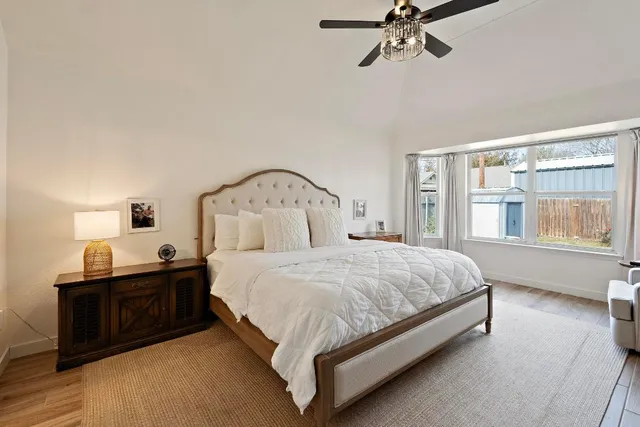 a bedroom with a bed and window