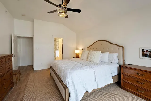 a bedroom with a bed and a dresser