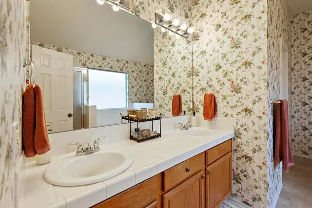 a bathroom with a sink and a mirror