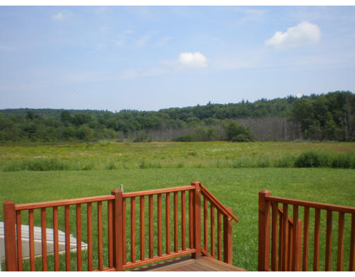 Lot 2 Adams Road Grafton, MA 01519 - Photo 20 of 26 a view of a wooden deck and a yard