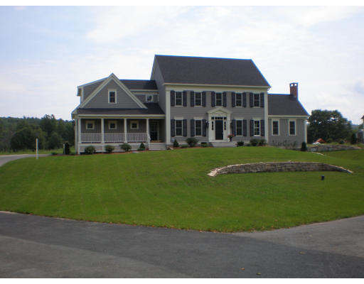 Lot 2 Adams Road Grafton, MA 01519 - Photo 2 of 26 a front view of a house with a garden