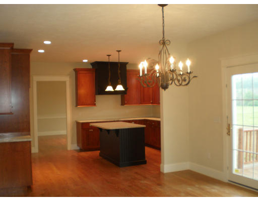 Lot 2 Adams Road Grafton, MA 01519 - Photo 9 of 26 a view of kitchen with kitchen island microwave and refrigerator
