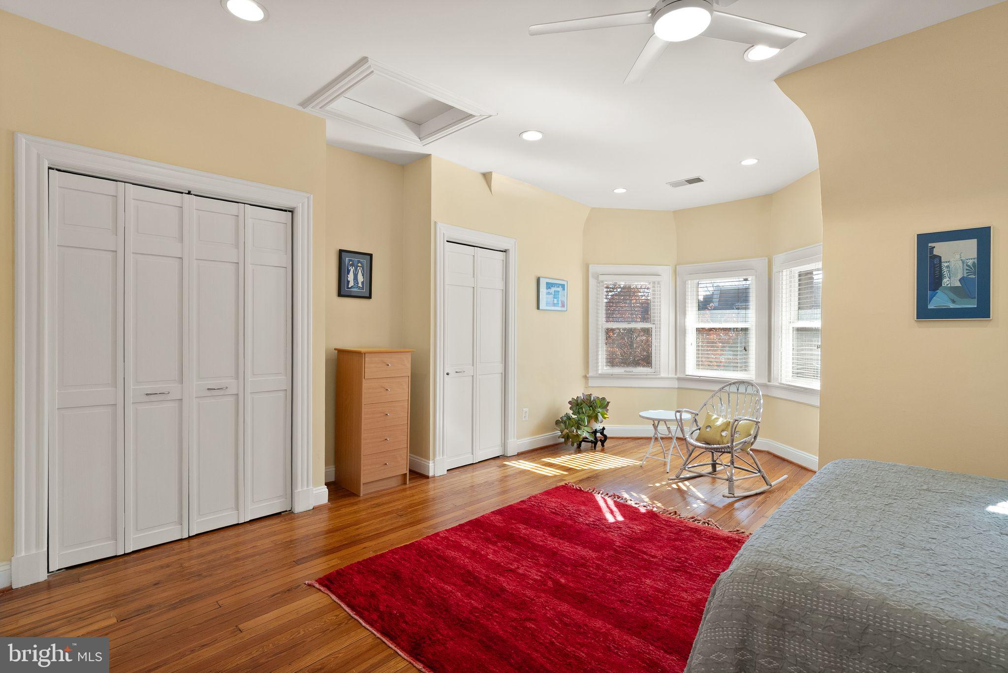 1335 Harvard Street Northwest, Unit PH2 Washington, DC 20009 - Photo 14 of 34 a bedroom with a bed and wooden floor