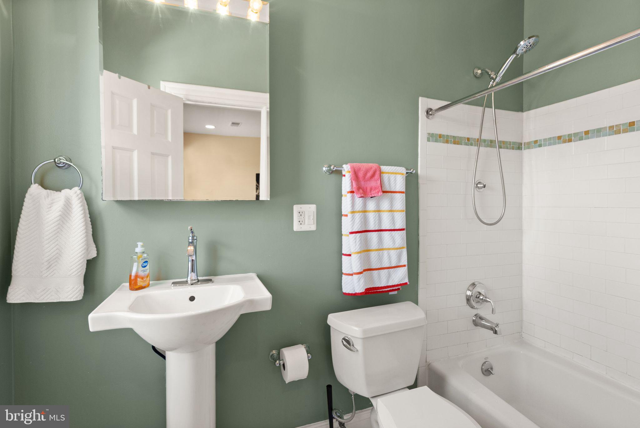 1335 Harvard Street Northwest, Unit PH2 Washington, DC 20009 - Photo 19 of 34 a bathroom with a sink toilet and shower