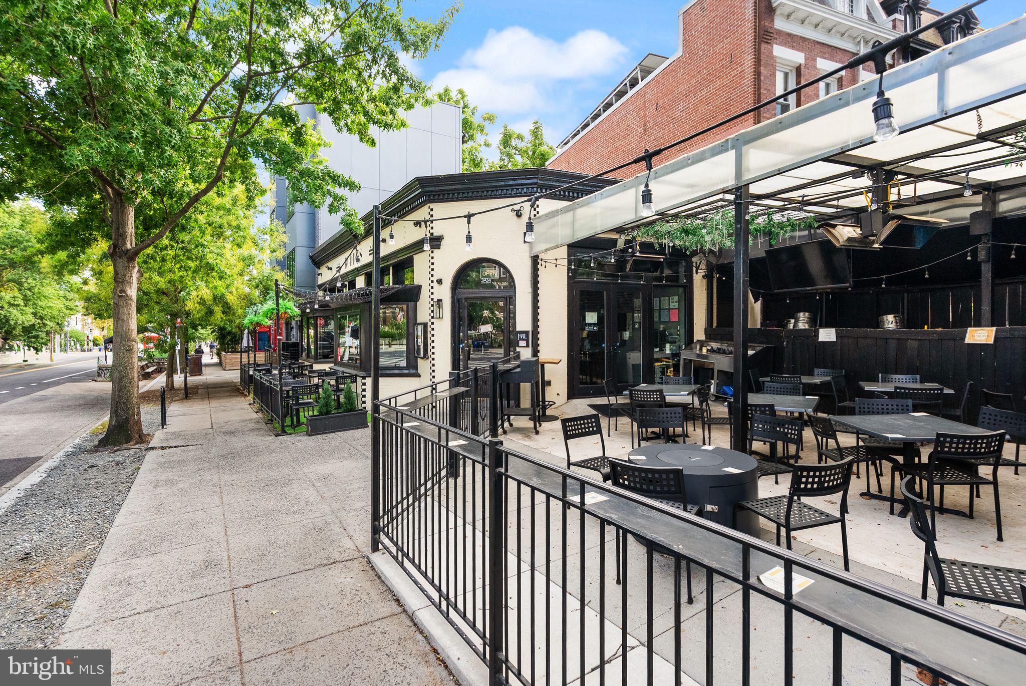1335 Harvard Street Northwest, Unit PH2 Washington, DC 20009 - Photo 26 of 34 a view of a chairs and tables in patio