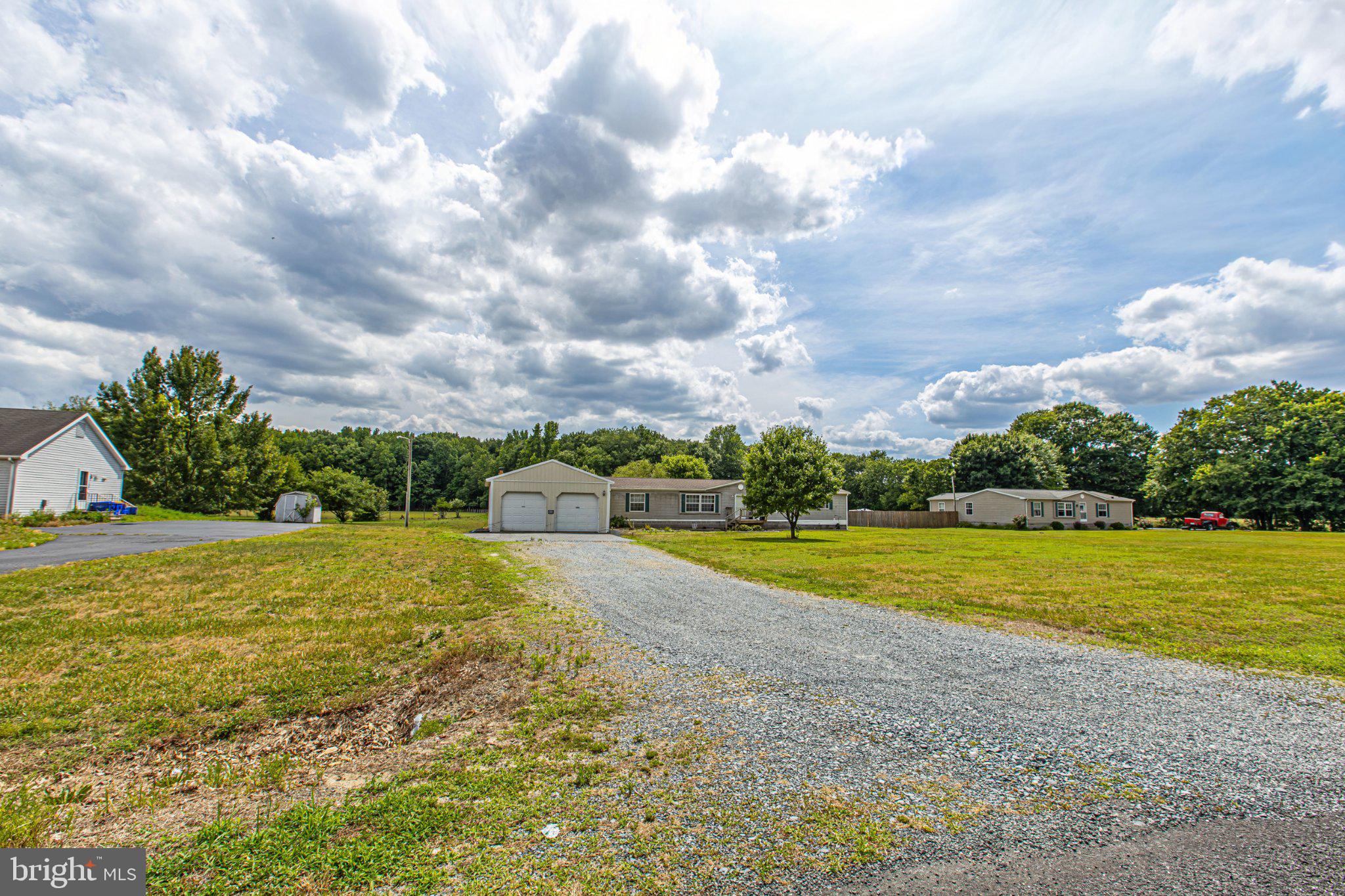 27864 Layton Road Laurel, DE 19956 - Photo 13 of 27 Spacious lot under a dramatic sky.