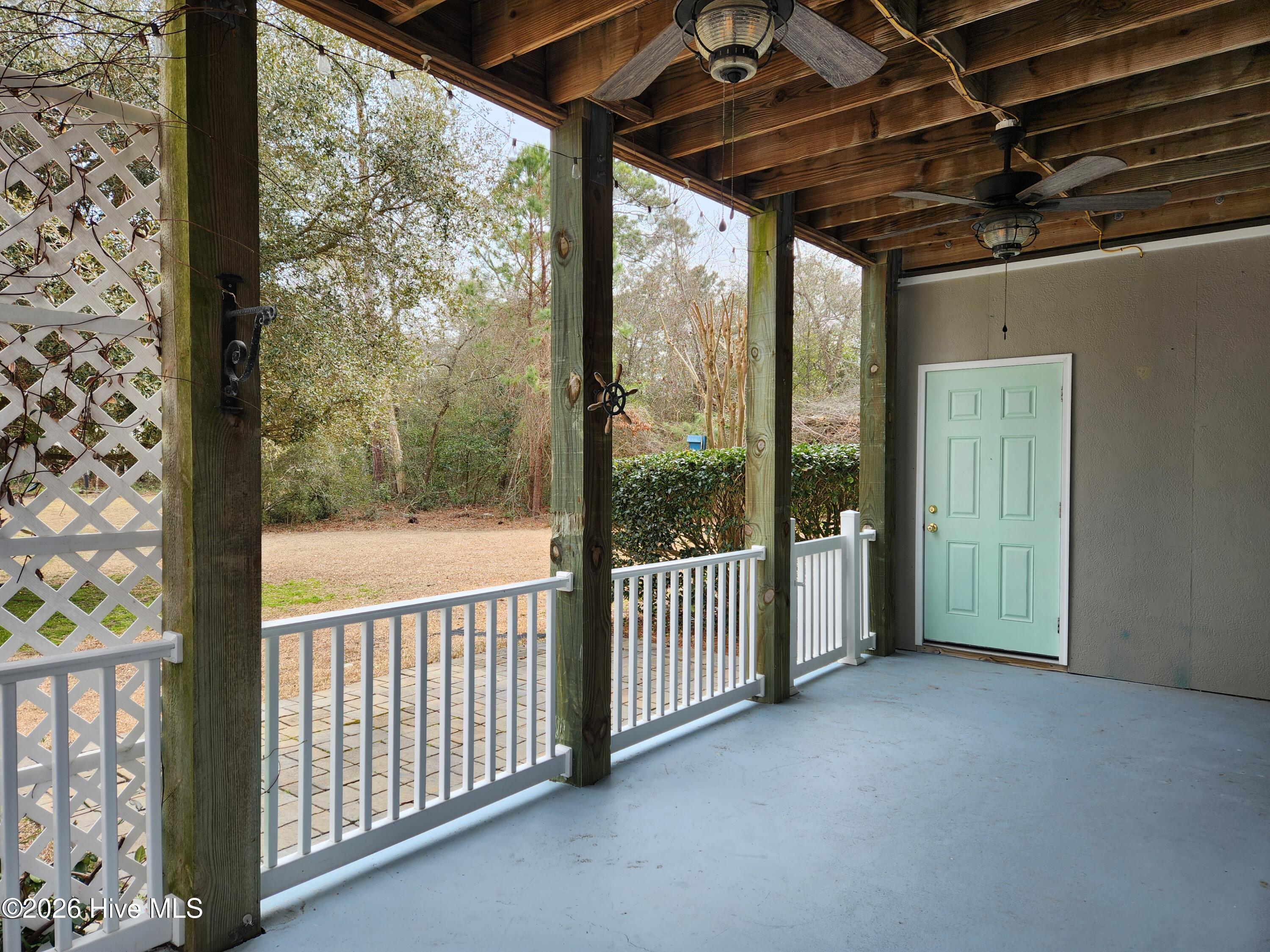 300 Lighthouse Lane, Unit A1 Cedar Point, NC 28584 - Photo 10 of 12 Fenced in back porch