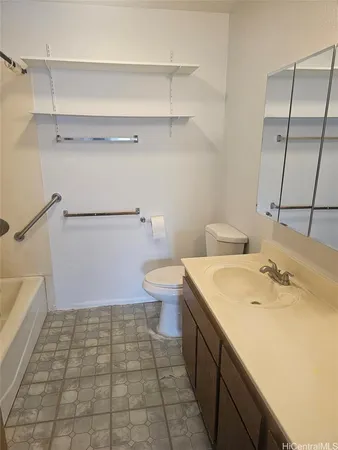 a bathroom with a sink a toilet and a shower