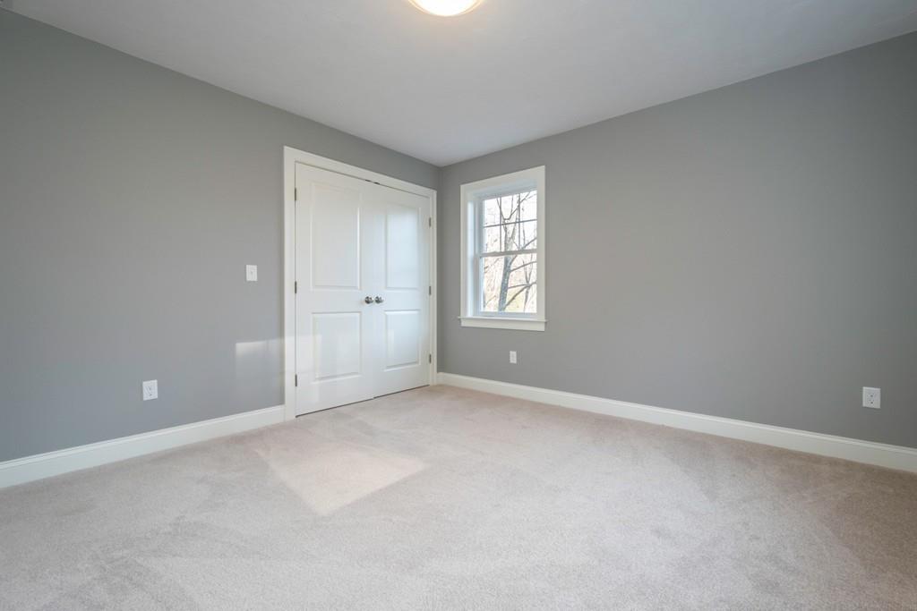 1120 Burroughs Road Boxborough, MA 01719 - Photo 33 of 42 an empty room with windows and closet