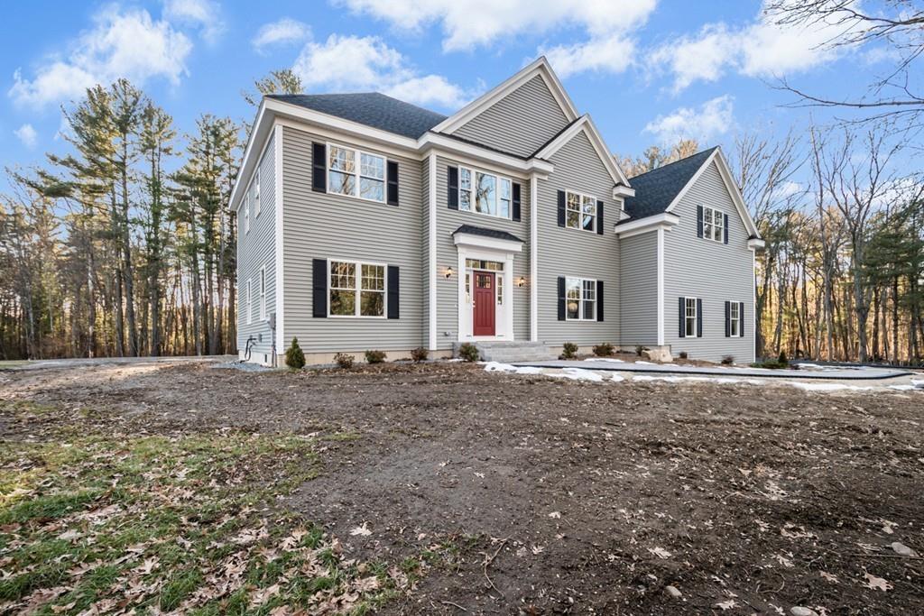 1120 Burroughs Road Boxborough, MA 01719 - Photo 40 of 42 a front view of a house with a yard