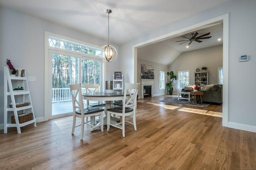 1120 Burroughs Road Boxborough, MA 01719 - Photo 10 of 42 a view of a dining room with furniture window and wooden floor