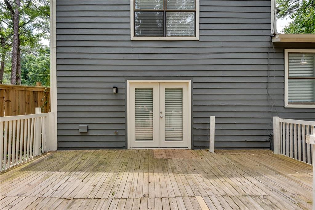 5611 Whittondale Road Lithonia, GA 30058 - Photo 30 of 34 a view of a house with a door and wooden floor