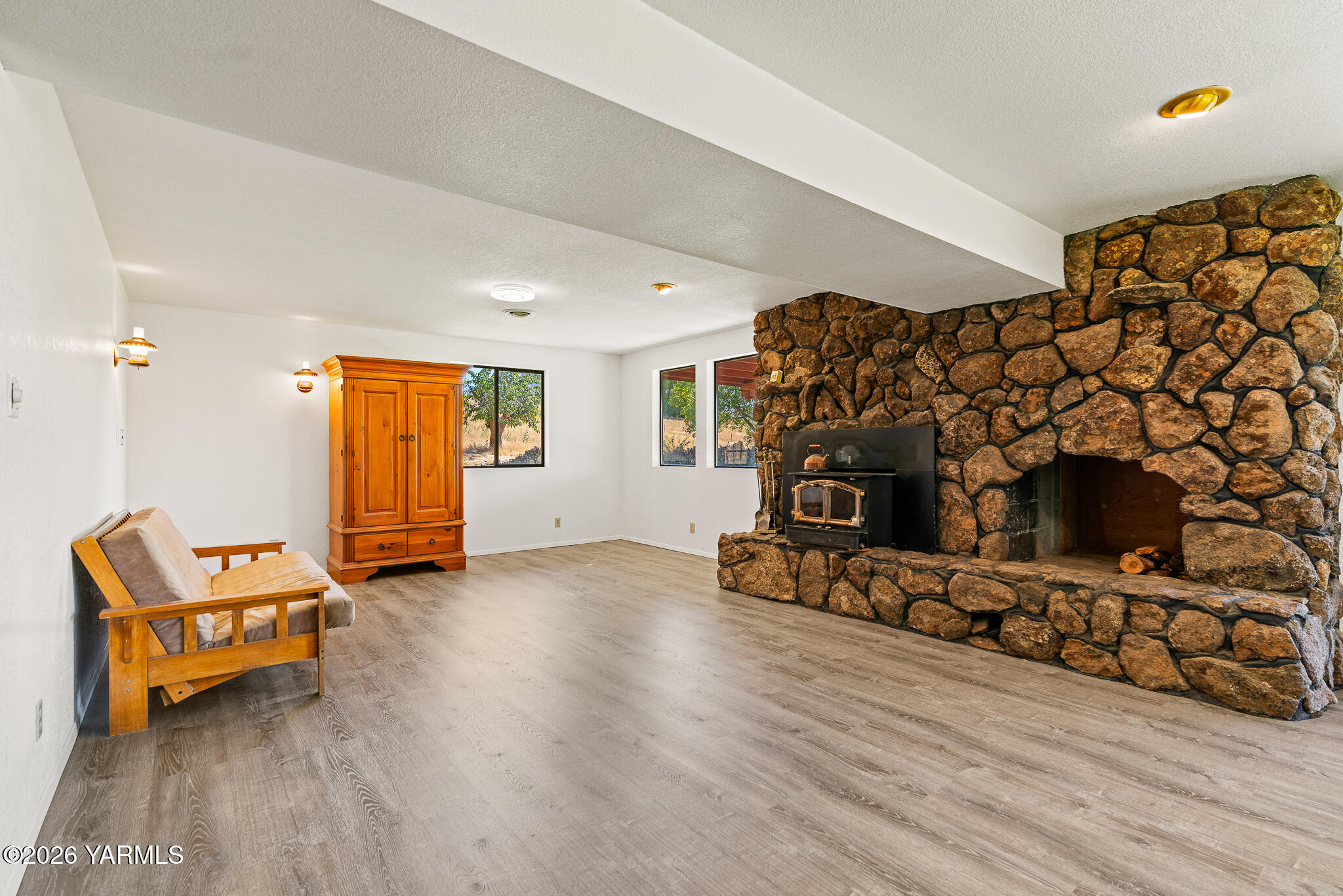 13619 Summitview Ext Road Yakima, WA 98908 - Photo 37 of 56 a living room with furniture and a wooden floor