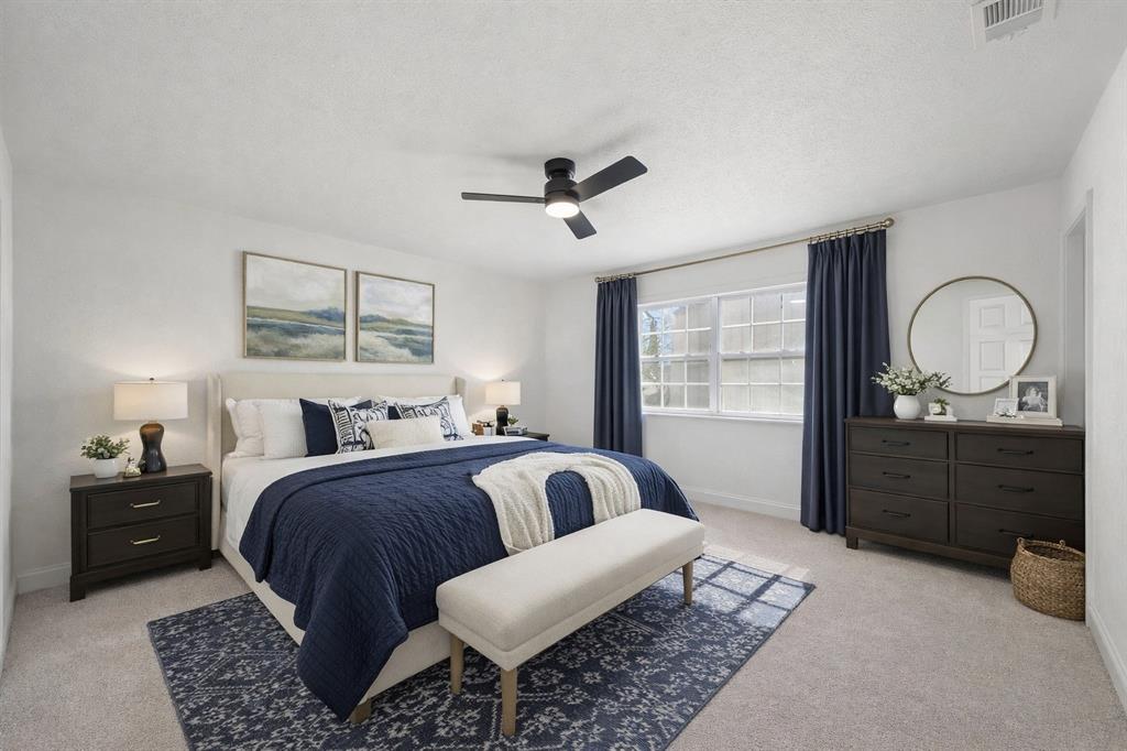 5516 Maple Lane Rowlett, TX 75089 - Photo 10 of 18 a bedroom with double bed and a dresser